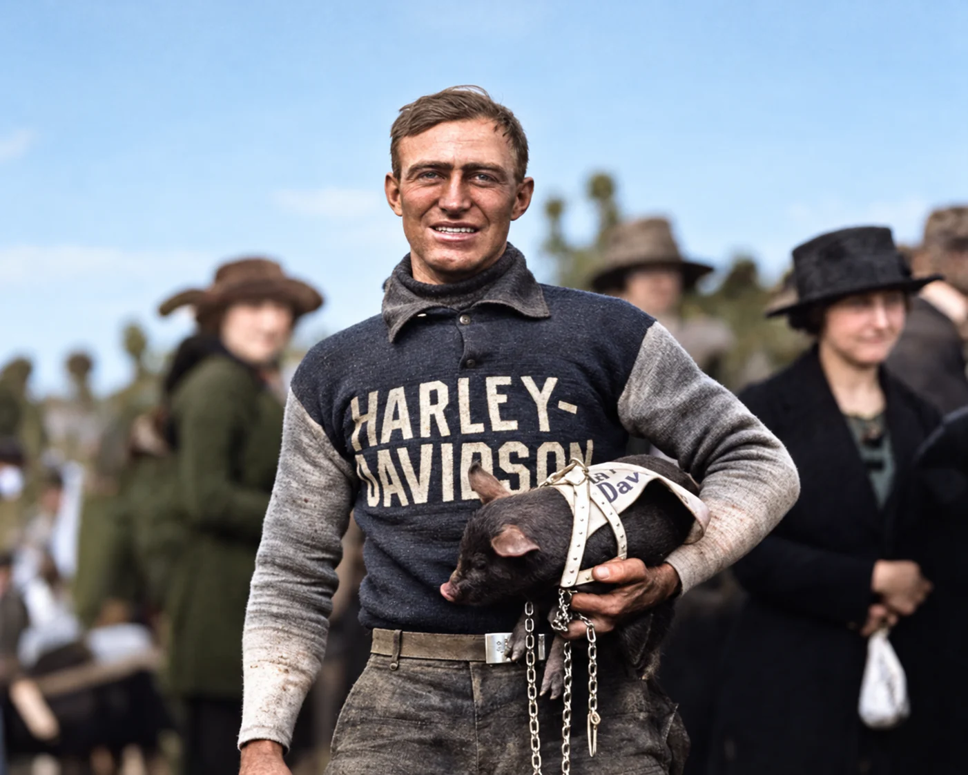 Restored and colorized portrait of Ray Weishaar with the pig mascot after the Marion motorcycle race