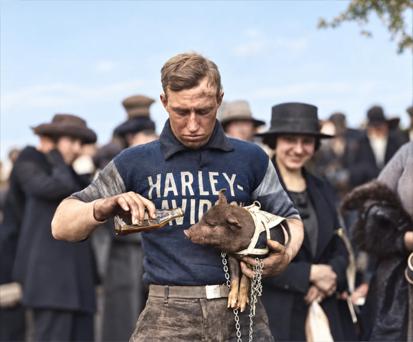 Restored photograph of Ray Weishaar with the Harley-Davidson team mascot pig